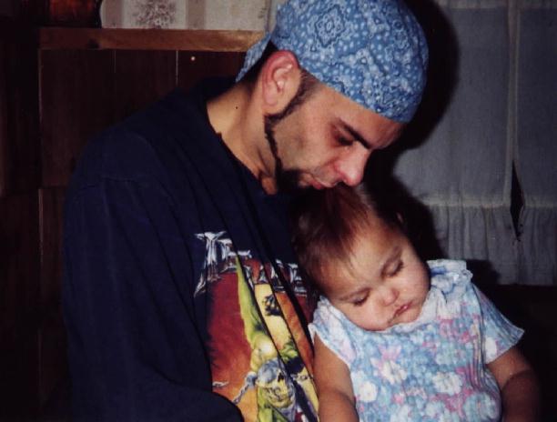 Michael Knappenberger holding his sleeping daughter Skylar.